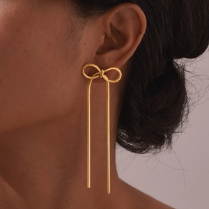 Boucles d'oreilles nœud dorées avec longues chaînes serpent pour femmes au style élégant