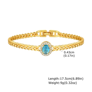 Detail view of gold Cuban chain bracelet with blue zircon and 17.5cm length markings