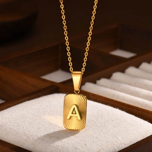 Gold stainless steel necklace with rectangular A letter pendant and textured finish