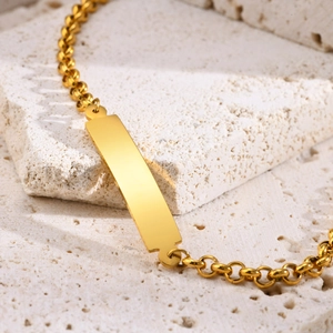 Polished gold stainless steel chain bracelet with engravable blank bar on stone