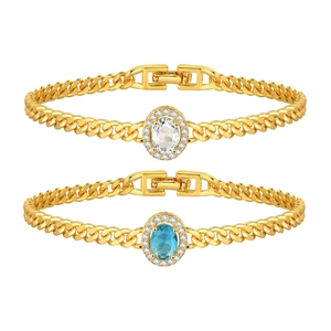 Gold-plated copper curb chain bracelets with oval green and white cubic zirconia stones