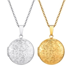 Colgante relicario redondo vintage en oro y plata con grabado floral detallado