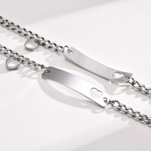 Polished stainless steel couple bracelets set with heart cutout and rectangular plaque