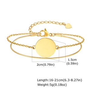 Detailed view of golden double-layer chain bracelet with 2cm blank round disc pendant