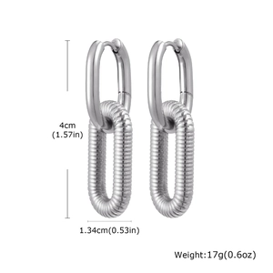 Detail of U-shape double link earrings in silver stainless steel with spiral texture