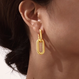 Minimalist interlocking gold oval earrings for women with textured geometric detail