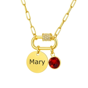 Detail of gold paperclip chain necklace with custom Mary nameplate and red gemstone