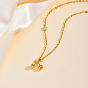 Minimalist gold stainless steel necklace with double cherry pendant and zircon detail
