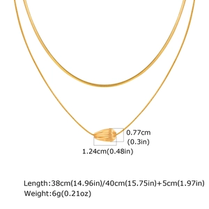 Detail showing gold teardrop pendant dimensions and double layer striped necklace chain