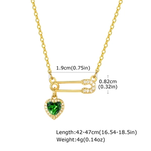 Detailed view of paperclip pendant with green heart stone and zircon accents