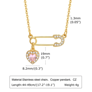 Detail of paperclip chain necklace showing pink heart pendant and safety pin dimensions