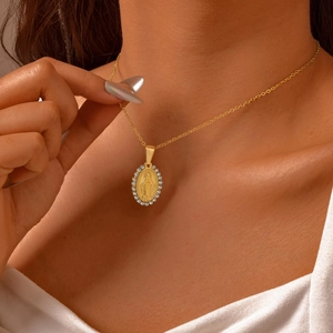 Gold stainless steel oval Virgin Mary pendant necklace with zircon halo worn on neck