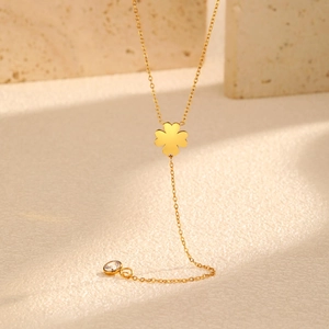 Collar en Y de acero inoxidable dorado con colgante de trébol pulido y borla de circón