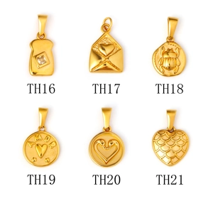 Collection of six vintage gold stainless steel pendants with heart and beetle motifs