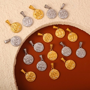 Detailed view of angel number coin pendants with crystal accents in gold and silver