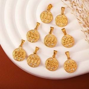 Golden round angel number pendants with zircon inlay from 111 to 999 on textured tray