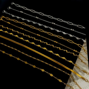 Collection of gold and silver stainless steel layered bracelets and anklets with leaf charms