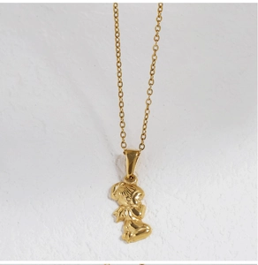 Close-up of a 18K gold plated cupid angel pendant on a delicate stainless steel chain
