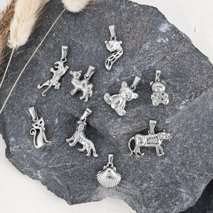 Detailed collection of 24k plated animal charms like tiger and fox on stone base