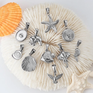 Polished silver stainless steel animal pendants including elephant and starfish on coral