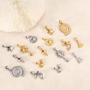 Polished stainless steel ocean themed pendants with dolphin shell and palm tree designs