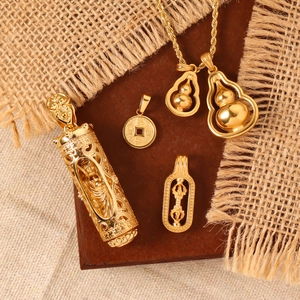Close-up of golden gourd and Buddhist charms on rustic wood and linen background