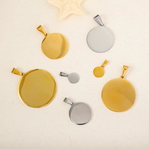 Polished mirror stainless steel round pendants in gold and silver with melon seed clasps
