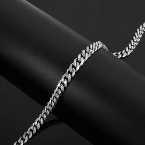 Detailed view of polished stainless steel Cuban link chain with high-gloss finish