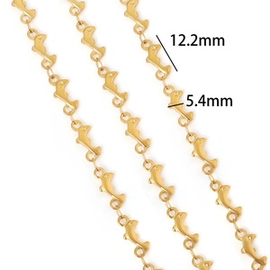 Macro shot of gold stainless steel dolphin links with precise 12.2mm by 5.4mm dimensions