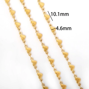 Macro detail of gold plated heart chain link showing measurements 10.1mm by 4.6mm