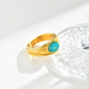 Vintage stainless steel gold ring featuring an oval turquoise amazonite gemstone inlay