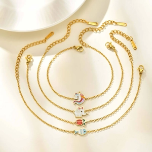 Set of four gold children's bracelets with unicorn elephant tulip and fish enamel charms