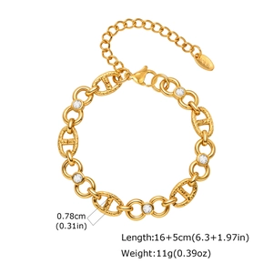 Close-up of gold stainless steel infinity link bracelet with clear cubic zirconia