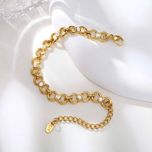 Detail of 18K gold-plated link bracelet with white zircon and lobster clasp closure