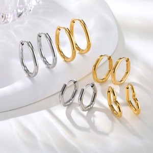 Set of gold and silver stainless steel geometric hoop earrings in heart and U-shape
