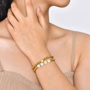 Double-layered gold bead bracelet featuring a heart charm and MAMA letter beads for women