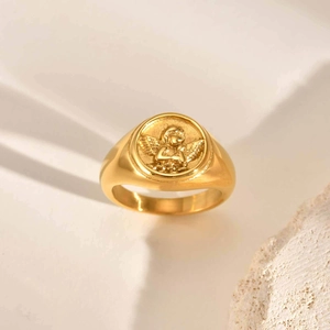 Polished 18K gold stainless steel signet ring featuring a raised cherub angel motif