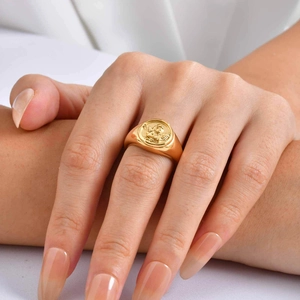 18K gold plated stainless steel signet ring with vintage angel cupid relief on model hand