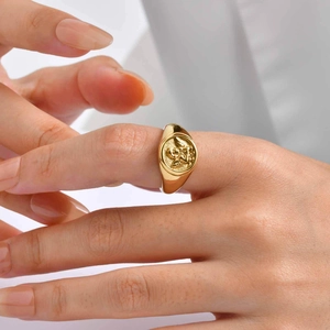 Vintage 18K gold plated stainless steel signet ring with detailed angel cupid relief