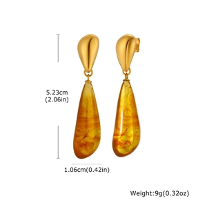 Detailed view of amber resin teardrop earrings with gold metal studs and size markings