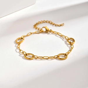 Macro detail of 18K gold-plated stainless steel chain bracelet with oval link connectors