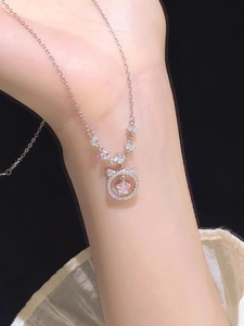 Detail of S925 silver cat pendant necklace featuring a pink star crystal and zircon