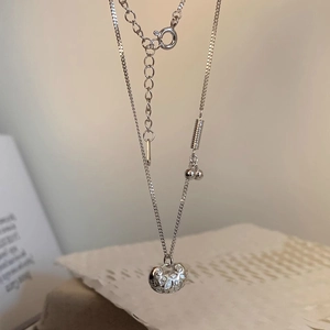 Elegant S925 silver peace lock necklace with hollow design and crystals on a mixed chain