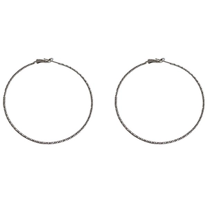 Chunky silver hoop earrings with textured beaded finish for a minimalist fashion statement
