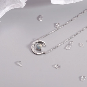 Elegant moon crescent necklace with iridescent labradorite stone and sparkling diamonds
