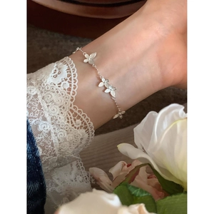 Elegant 925 silver butterfly charm bracelet for women with delicate brushed metal finish