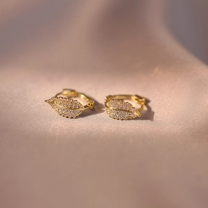 Elegant rose gold leaf earrings featuring shimmering cubic zirconia with a secure hoop clasp
