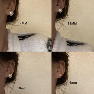 Pendientes de perlas vintage francesas de 6mm a 14mm mostrados en una modelo
