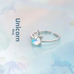 Detail of adjustable unicorn ring featuring an aurora moonstone and S925 silver finish