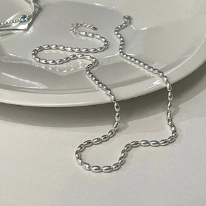 Minimalist S925 silver plated rice bead necklace on white plate with lobster clasp